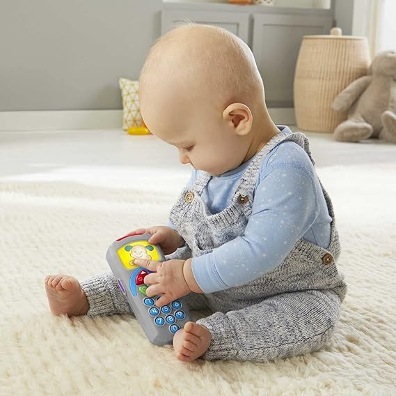 Fisher-Price Baby Learning Toy Laugh & Learn Puppy’s Remote Pretend TV Control with Music & Lights for Developmental Play Infants Ages 6+ Months